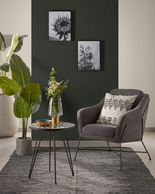 Brida armchair in dark grey with steel structure in black finish.