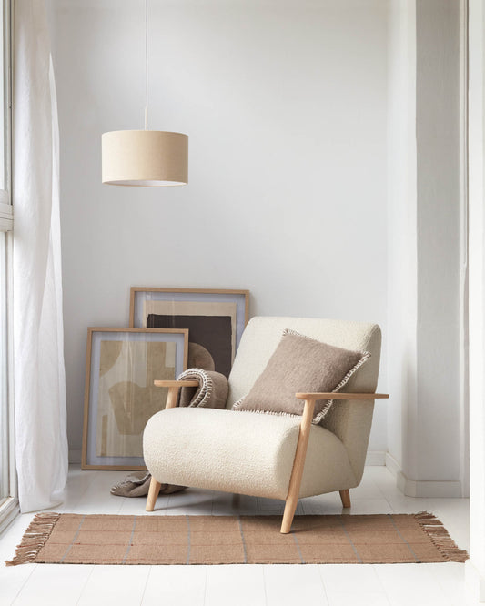 Meghan armchair in white bouclé with solid ash legs with natural finish