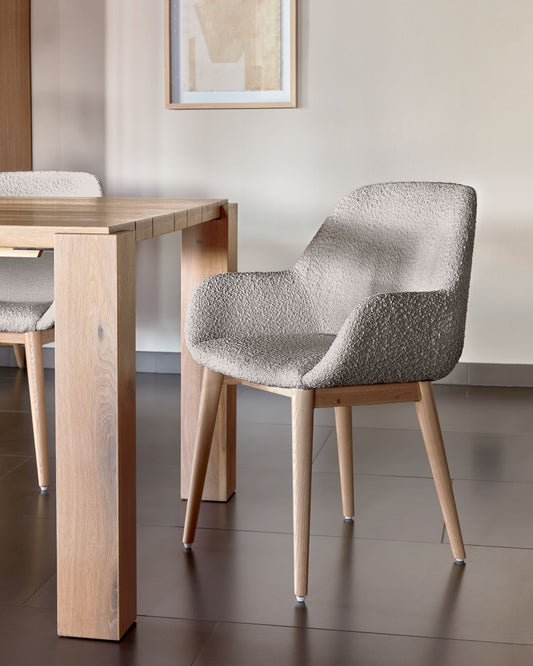 Konna chair in grey bouclé with solid ash wood legs in a natural finish