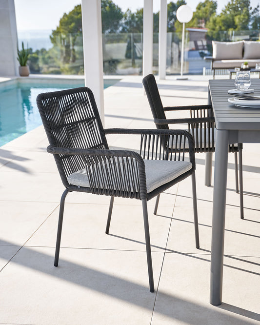 Samanta stackable chair made from black cord and galvanised steel legs.