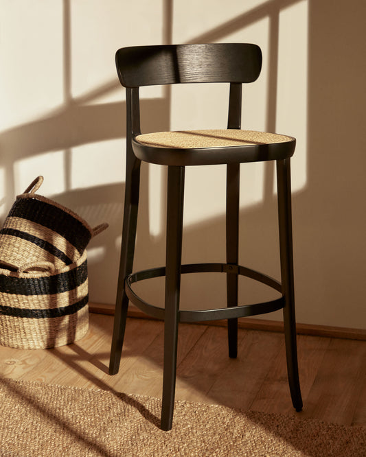 Romane beechwood stool with a black finish, ash wood veneer and ratan seat height 75 cm