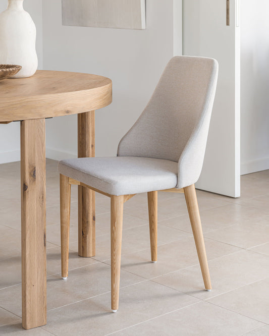 Rosie chair in beige chenille with solid ash wood legs in a natural finish