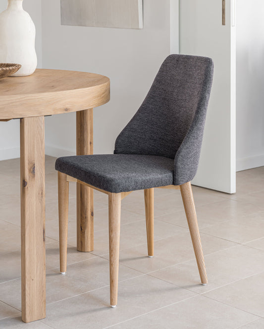 Rosie chair in dark grey chenille with solid ash wood legs in a natural finish