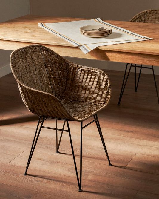 Chart chair made from rattan with black finished steel legs