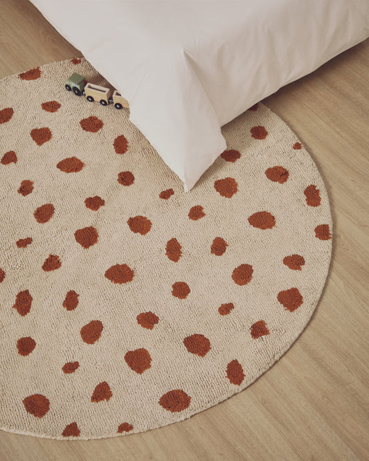 Tandani beige cotton round rug with orange cheetah design Ø 100cm