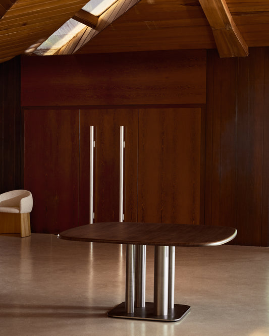 Melvar table made from walnut veneer and legs with brushed stainless steel base 150 x 150cm