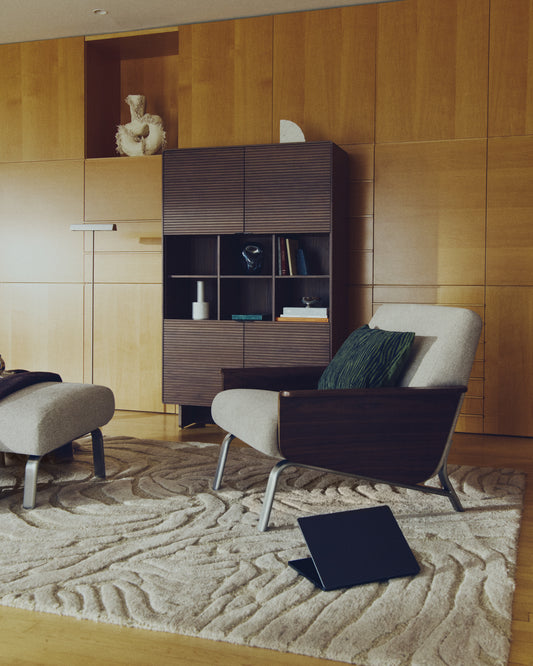 Amsen light brown armchair in walnut plywood with legs in brushed stainless steel