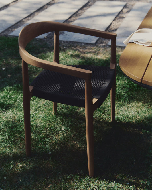 Ydalia stackable outdoor chair in solid teak wood with natural finish and black rope