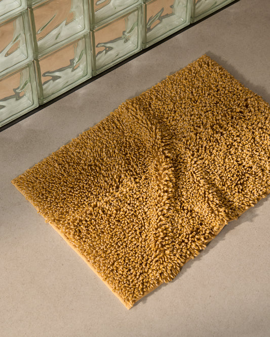 Aroia mustard bouclé melange bathmat 50 x 70cm