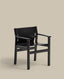 Jan chair made of black recycled leather fibres and FSC 100% solid ash wood with black finish