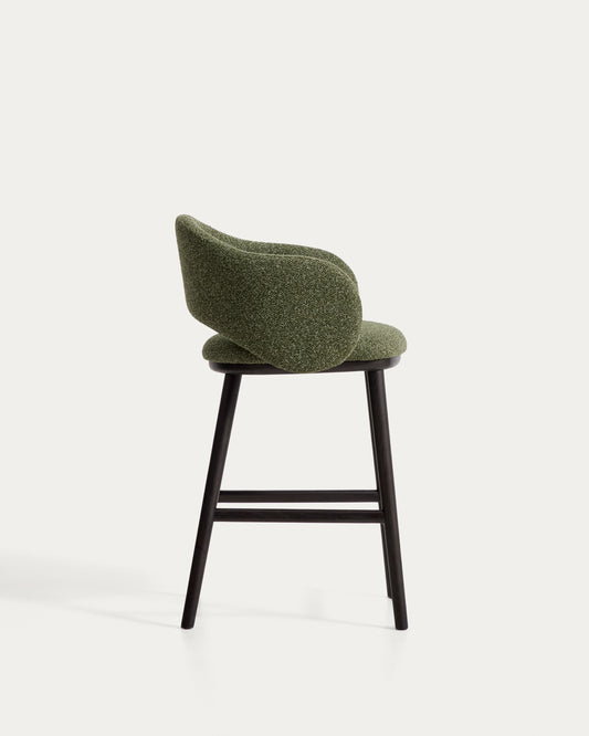 Maina stool in thick green chenille with solid ash wood legs and a ebonised finish, FSC Mix Credit 65 cm