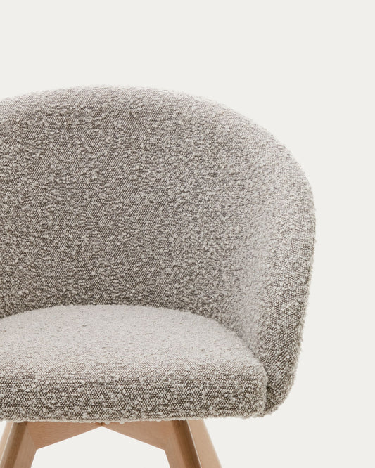 Marvin swivel chair with grey bouclé and beech wood legs in a natural finish FSC 100%