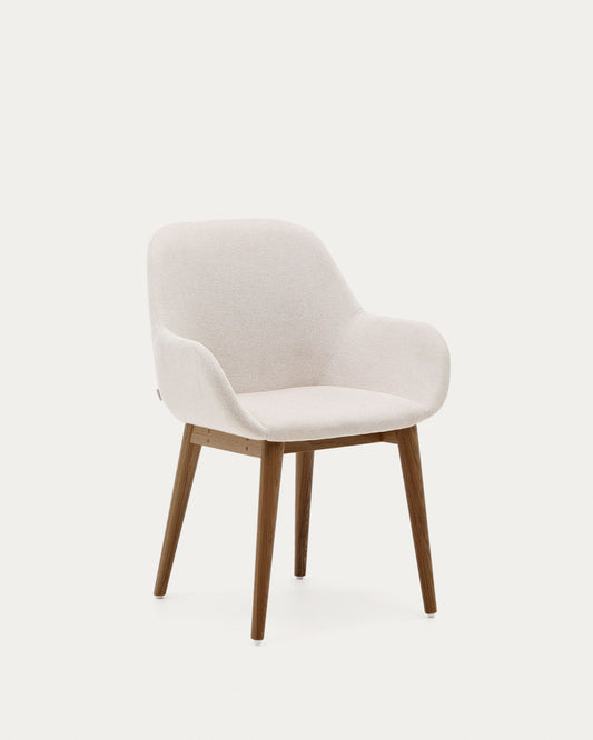 Konna chair in beige with solid ash wood legs in a dark finish