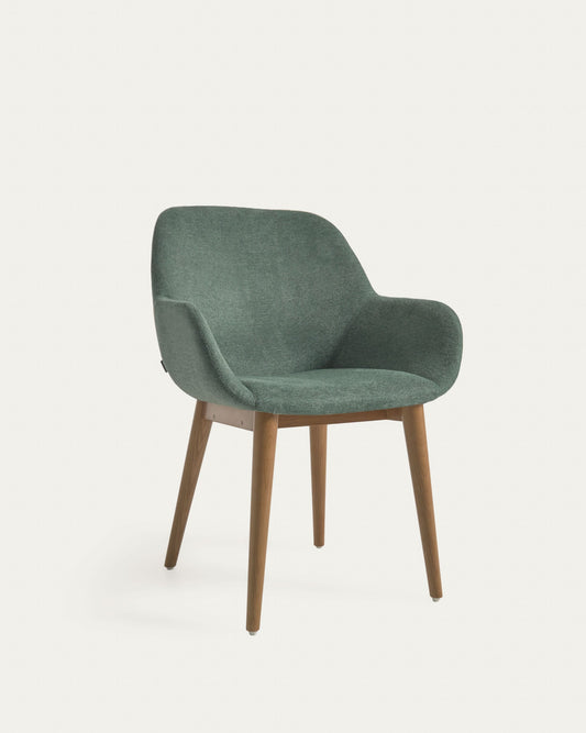 Konna chair in green with solid ash wood legs in a dark finish