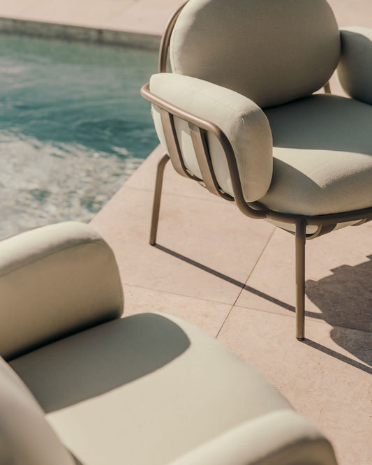 Joncols outdoor armchair in aluminium with green painted finish and beige cushions