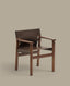 Jan chair made of dark brown recycled leather fibres and FSC 100% solid ash wood with walnut-coloured finish