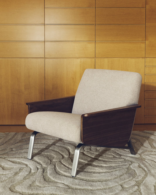 Amsen light brown armchair in walnut plywood with legs in brushed stainless steel